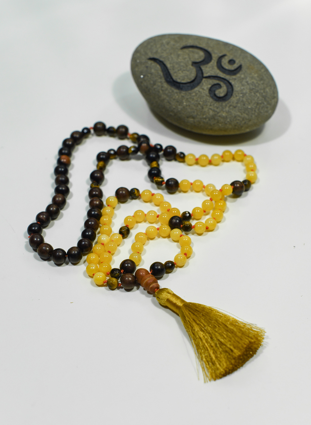 Mala Yellow Jade + Tigers Eye + Wood personal power – abundance – mental clarity – balance: 1st Muladhara, 2nd Swadhisthana, 3rd Manipura, 4th Anahata Chakra’s (root, naval, solar plexus + heart) handcrafted by Fia